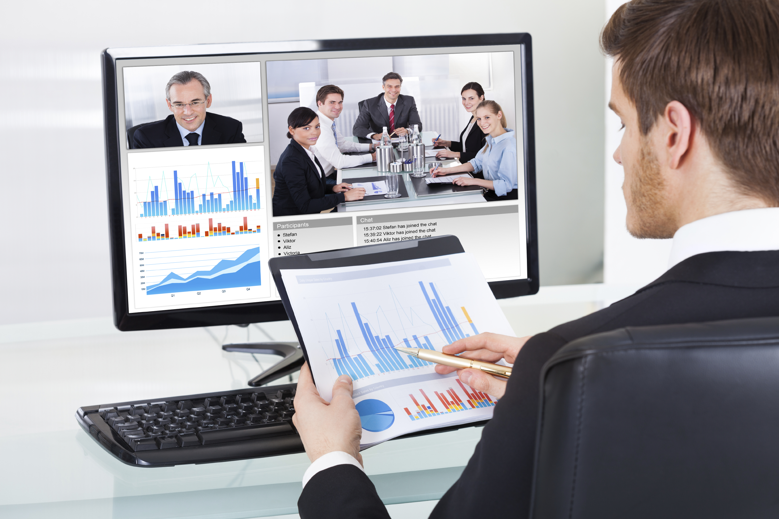 Businessman Video Conferencing With Colleagues